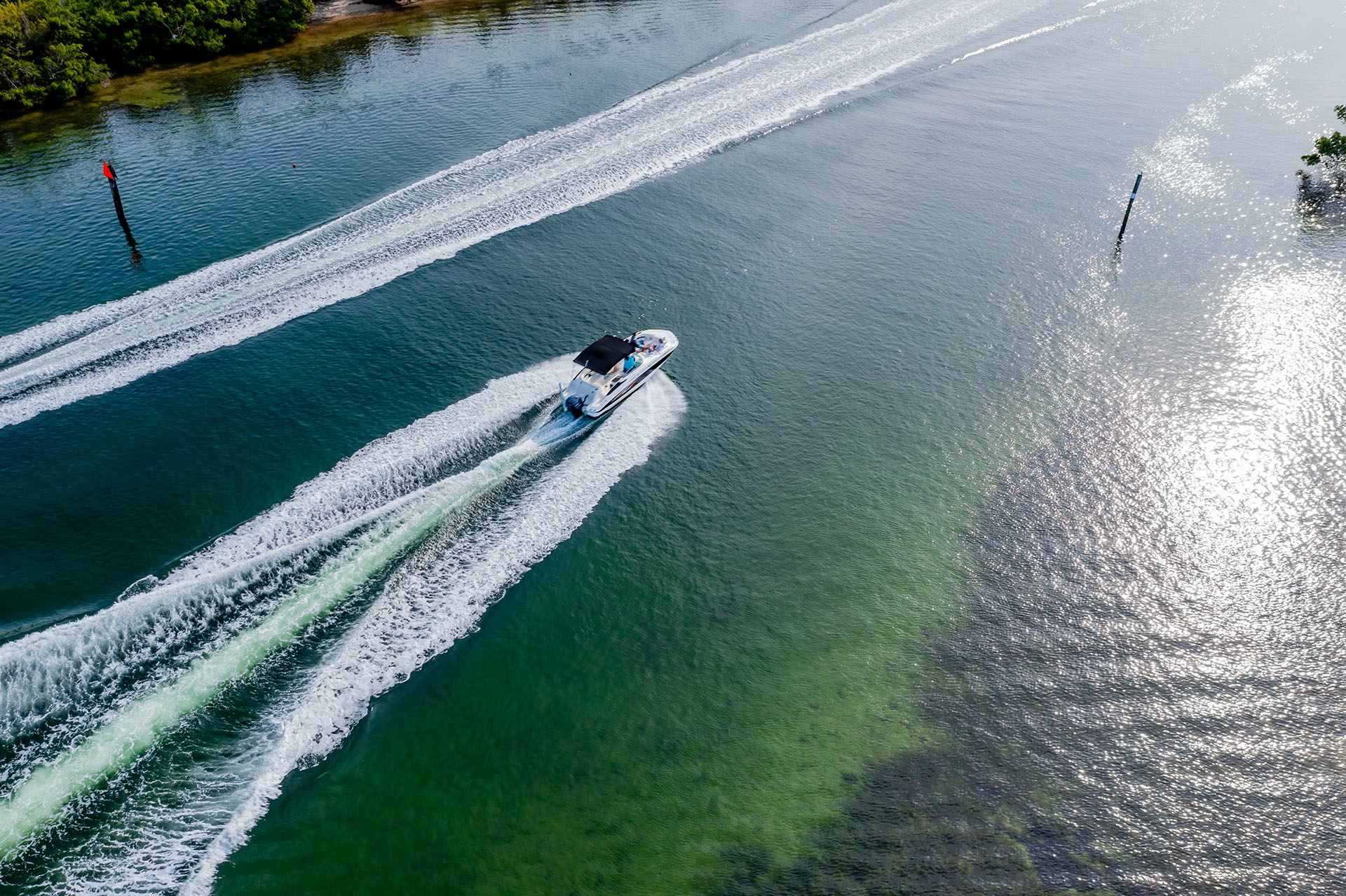 boat moving into sunrise